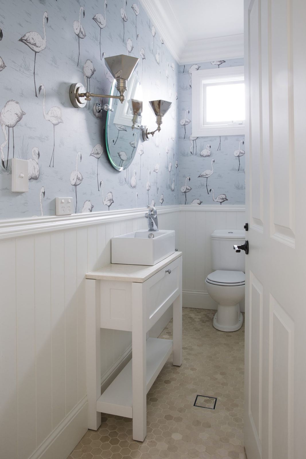 Balgowlah Heights, powder room with patterned wallpaper, white vanity and wall sconces, built by HP Constructions with All Australian Architecture