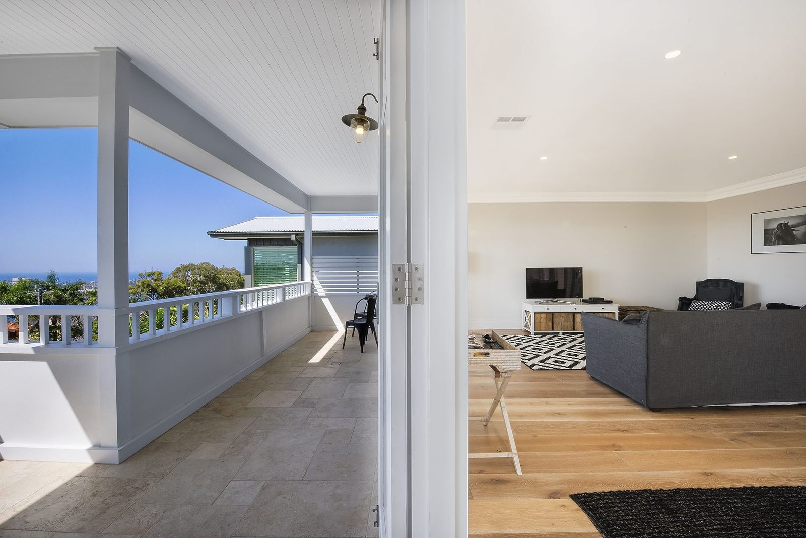 Balgowlah Heights, covered balcony with coastal view opening to the living room, built by HP Constructions with All Australian Architecture