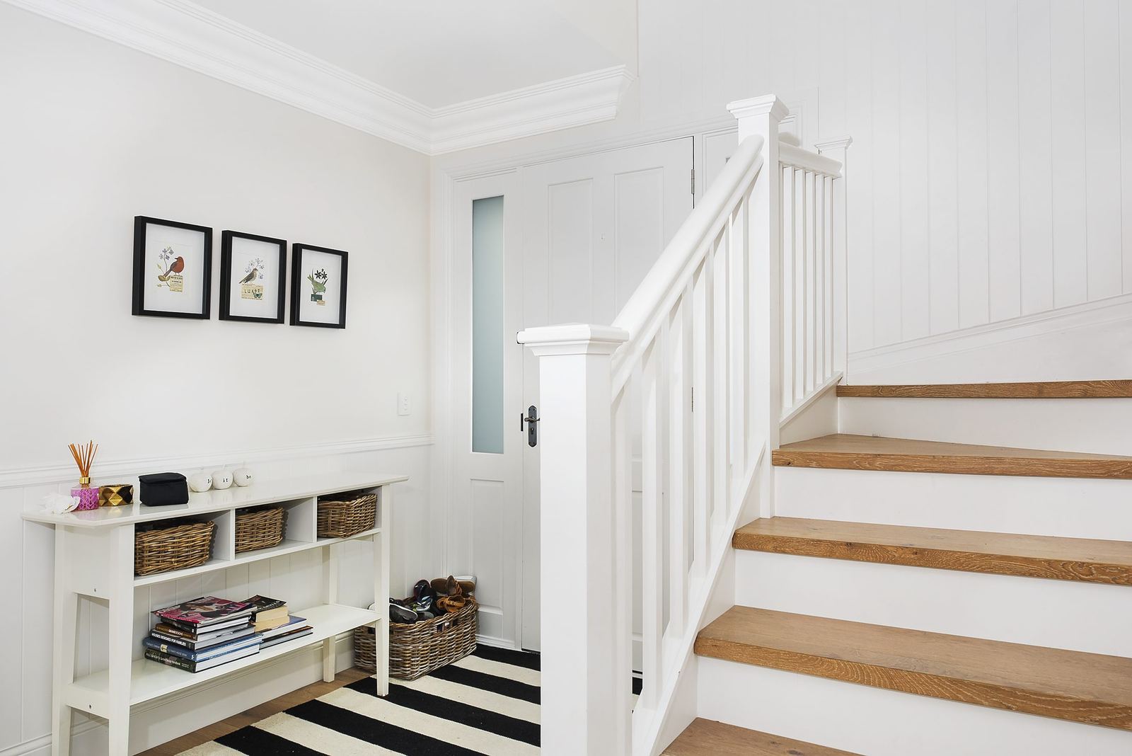 Balgowlah Heights, white timber staircase and entry hall with console table and striped runner, built by HP Constructions with All Australian Architecture