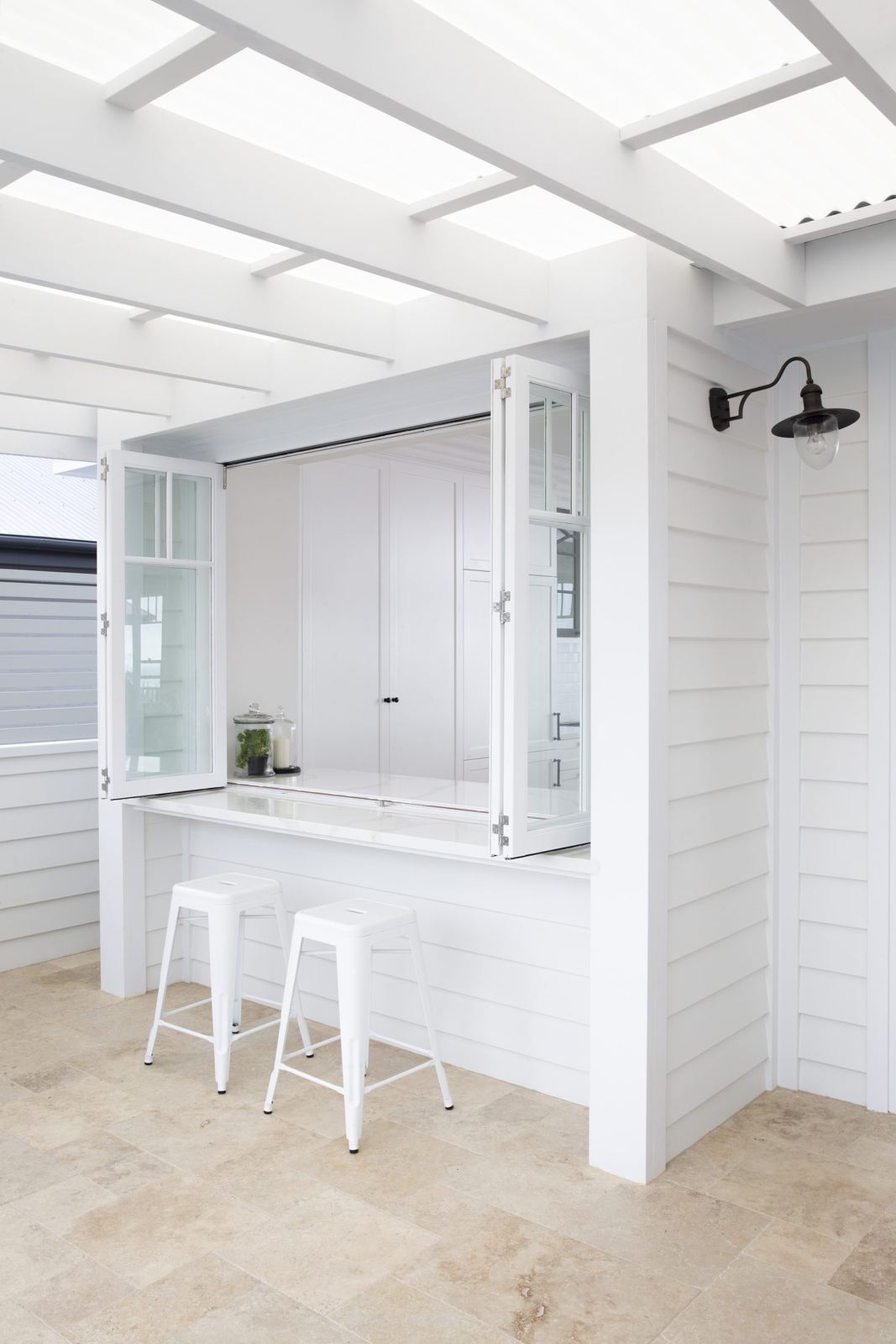 Balgowlah Heights, glass-roofed servery with white bar bench and bar stools, built by HP Constructions with All Australian Architecture