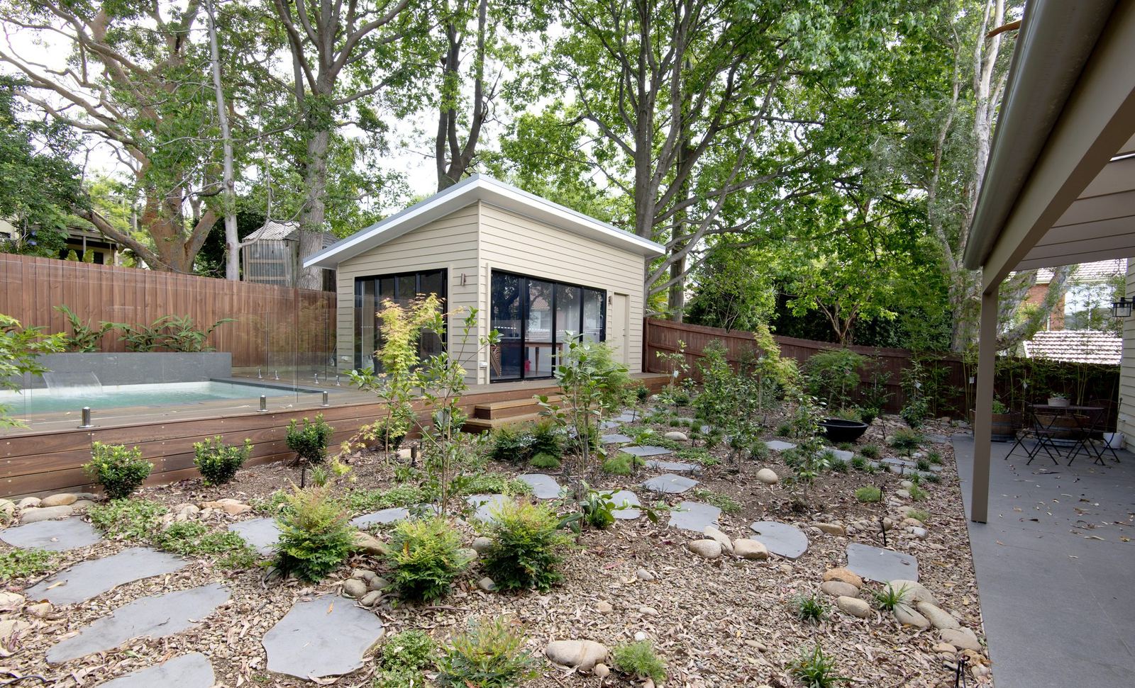 Balgowlah, landscaped rear garden with cabana, concrete pool and stone stepping paving, built by HP Constructions with Scope Architects
