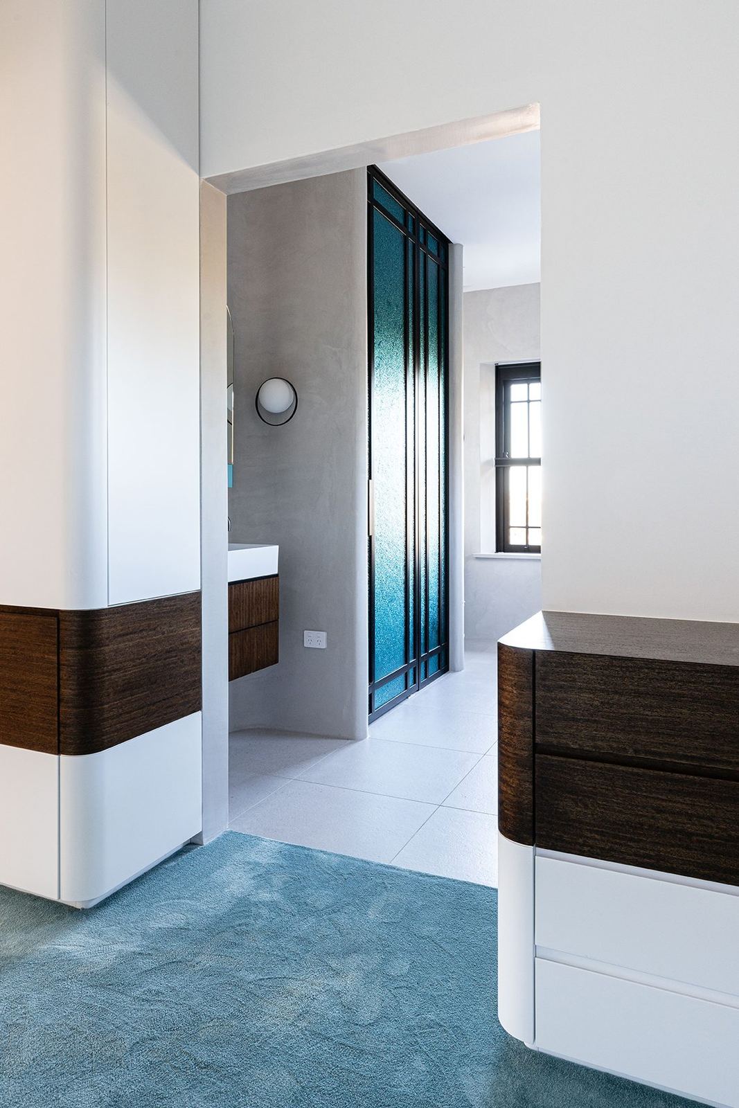 Bellevue Hill, hallway with white and dark timber joinery and teal flooring, built by HP Constructions with Foster & Associates