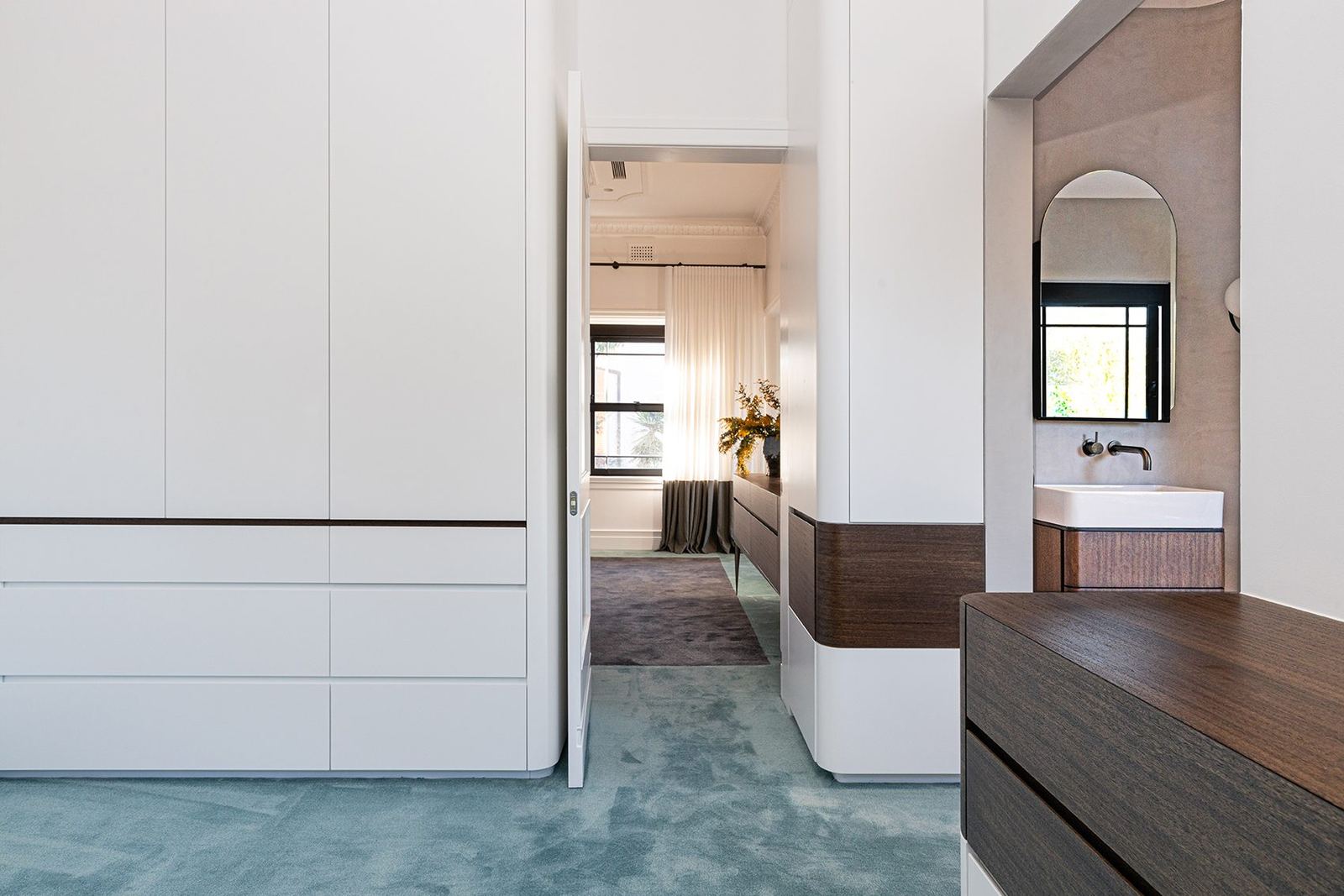 Bellevue Hill, walk-in robe with white joinery and teal carpet beside a vanity, built by HP Constructions with Foster & Associates