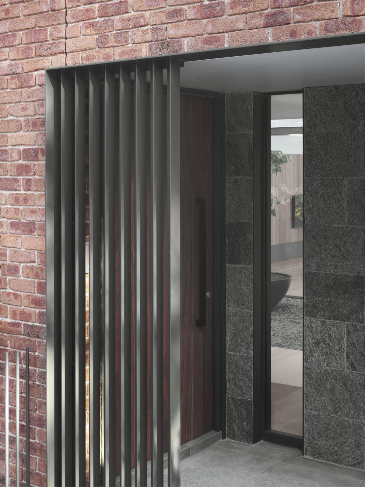 Castle Cove, exterior detail of brick wall with dark timber sliding screen, built by HP Constructions with Dieppe Design