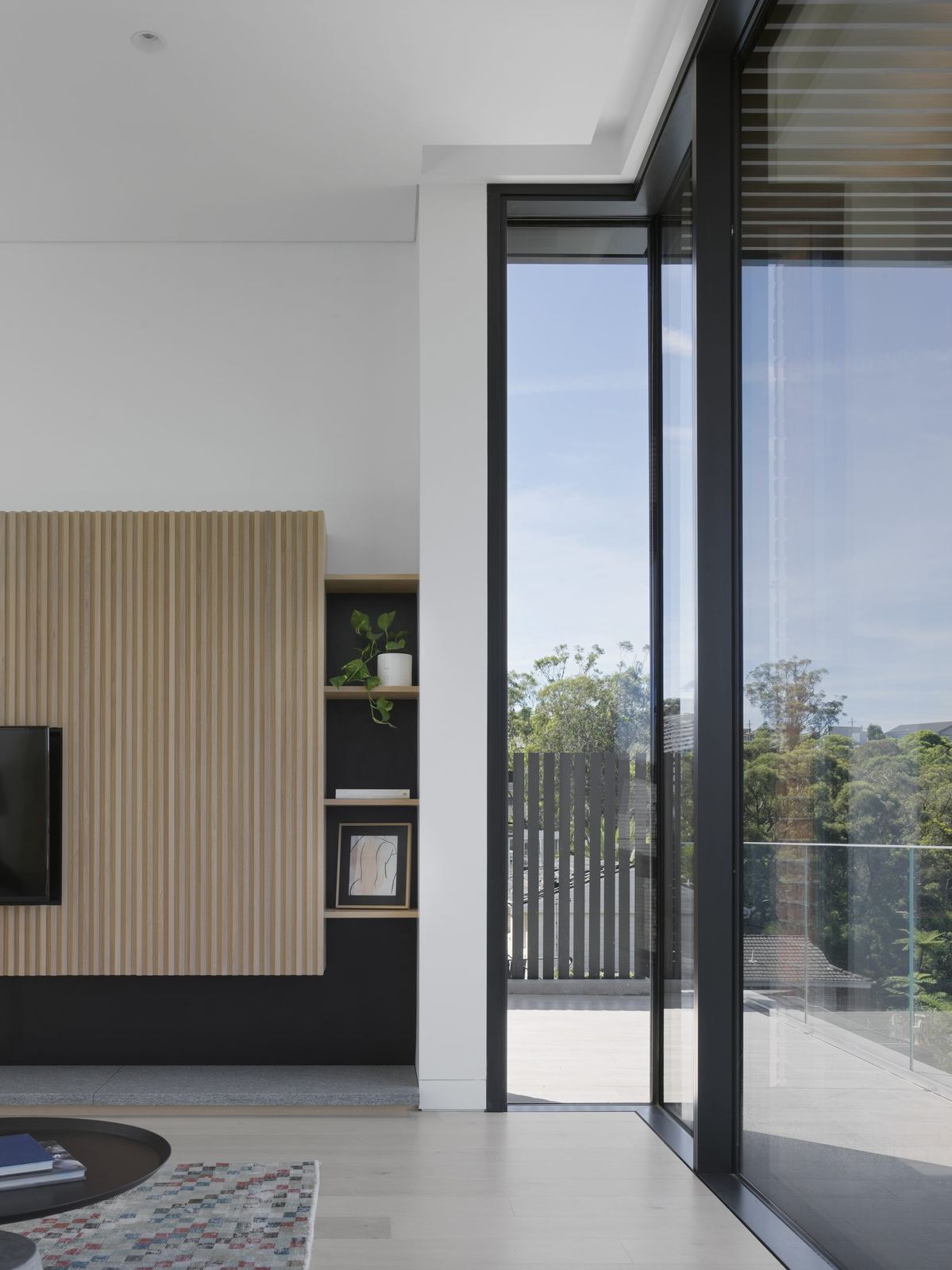 Castle Cove, kitchen with timber joinery and sliding door to balcony view, built by HP Constructions with Dieppe Design