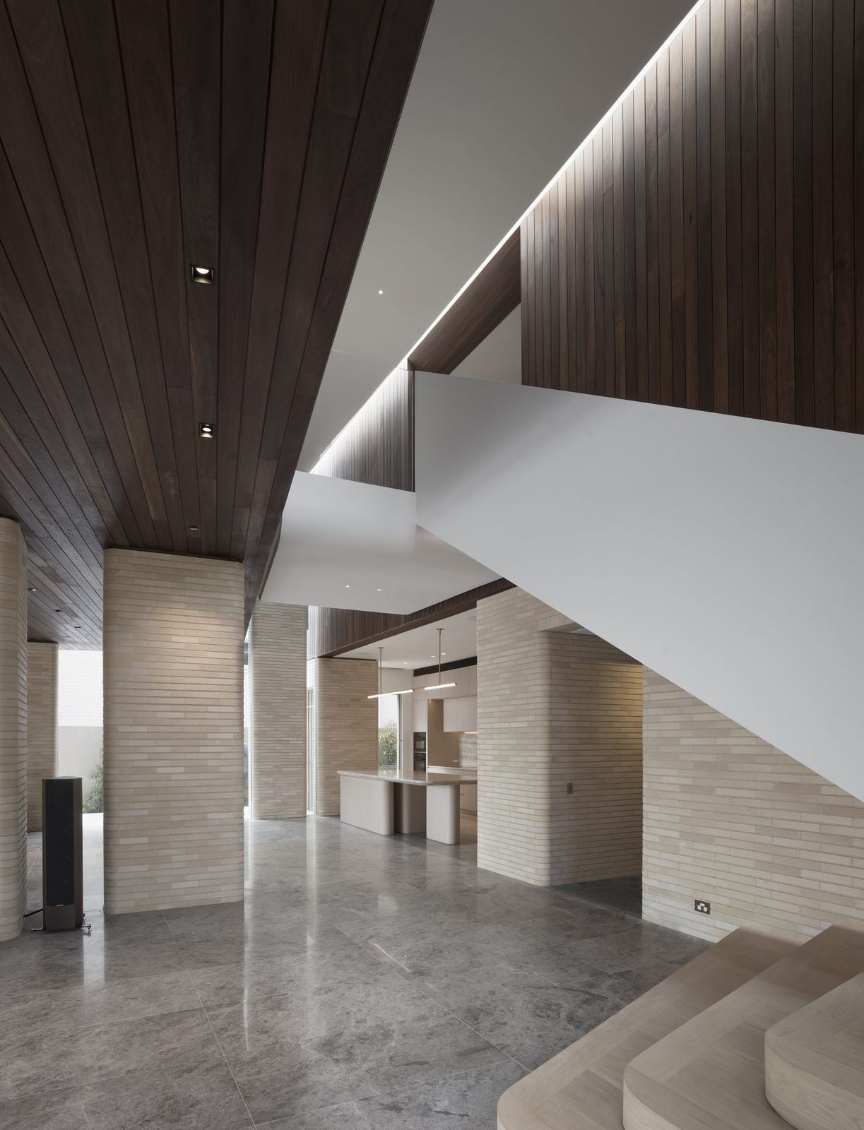 Castlecrag, interior with timber-lined ceiling, travertine walls and stone floor, built by HP Constructions with FJC Studio