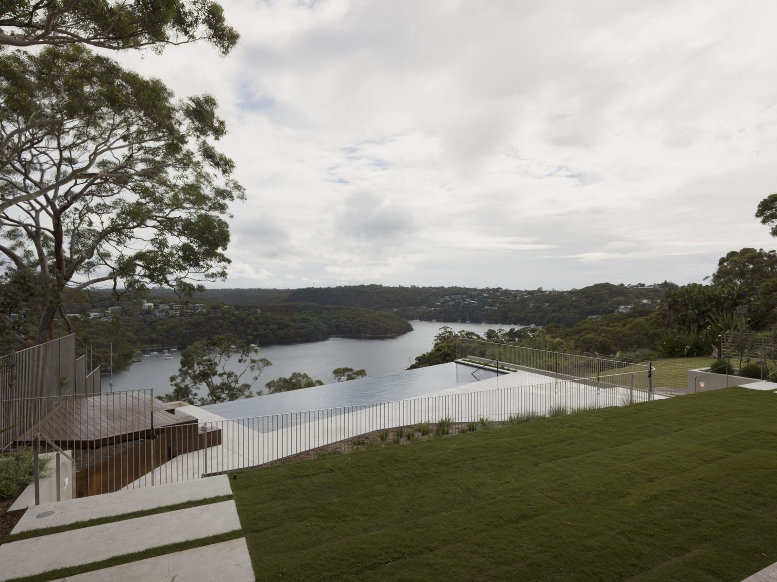 Castlecrag, terraced landscaped garden overlooking bushland and water inlet, built by HP Constructions with FJC Studio