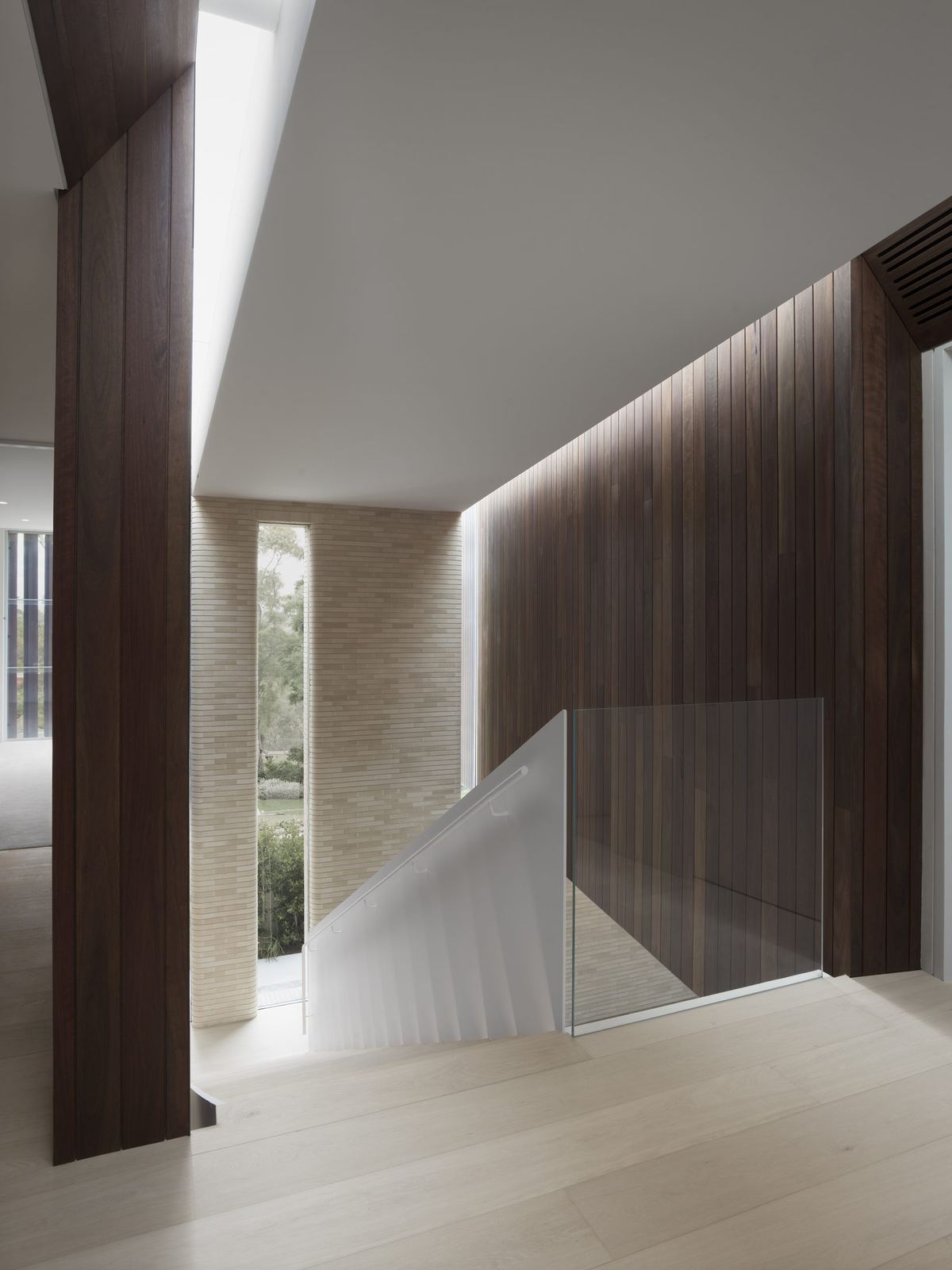 Castlecrag, stair void with timber walls and sculptural white ceiling, built by HP Constructions with FJC Studio
