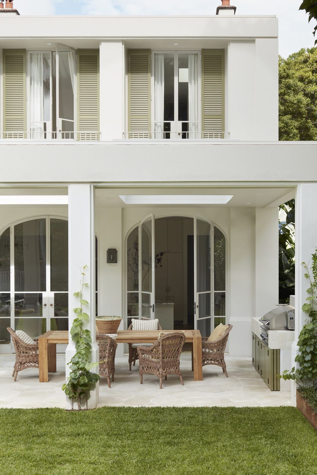 Darling Point, rear facade of white Federation home with shuttered upper balcony, built by HP Constructions with Hancock Architects