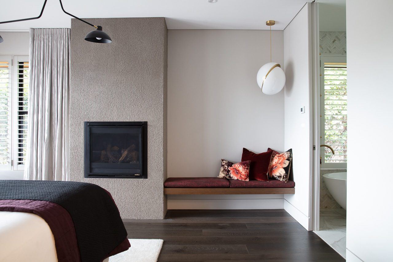 Hunters Hill, bedroom with fireplace, built-in window seat and ensuite beyond, built by HP Constructions with Dale Design Group