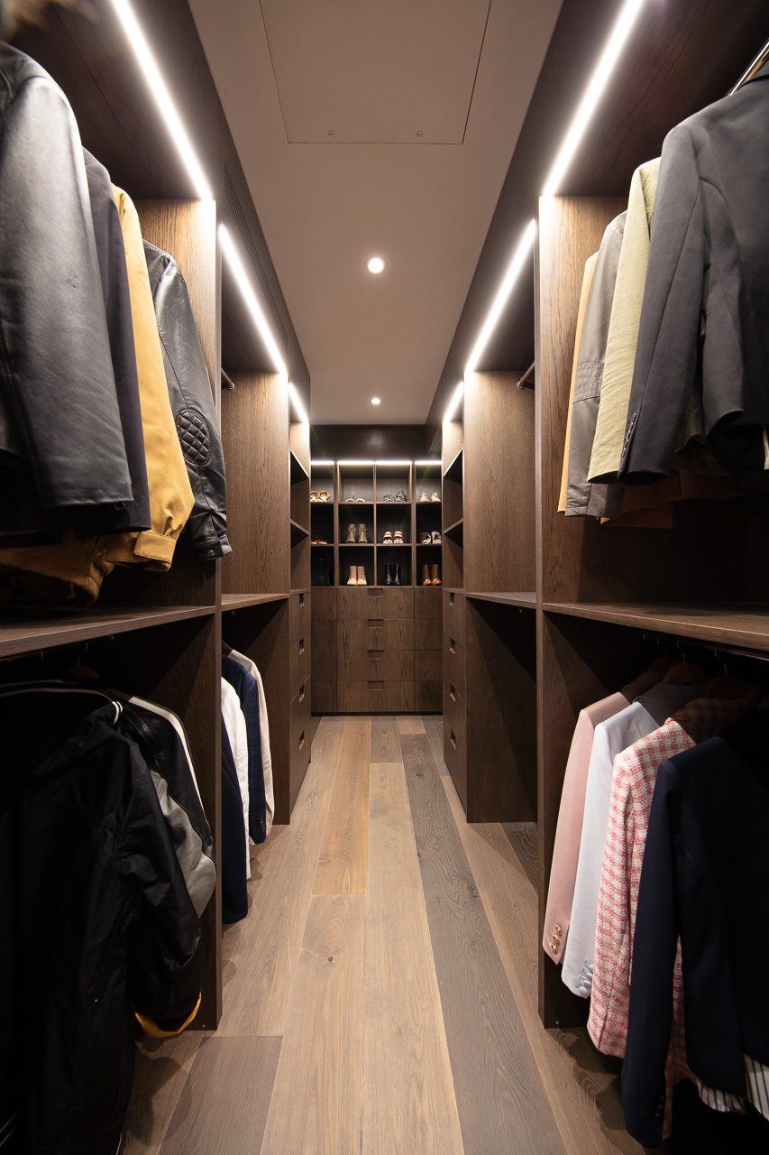 Hunters Hill, walk-in dressing room with LED-lit joinery and hanging clothes, built by HP Constructions with Dale Design Group