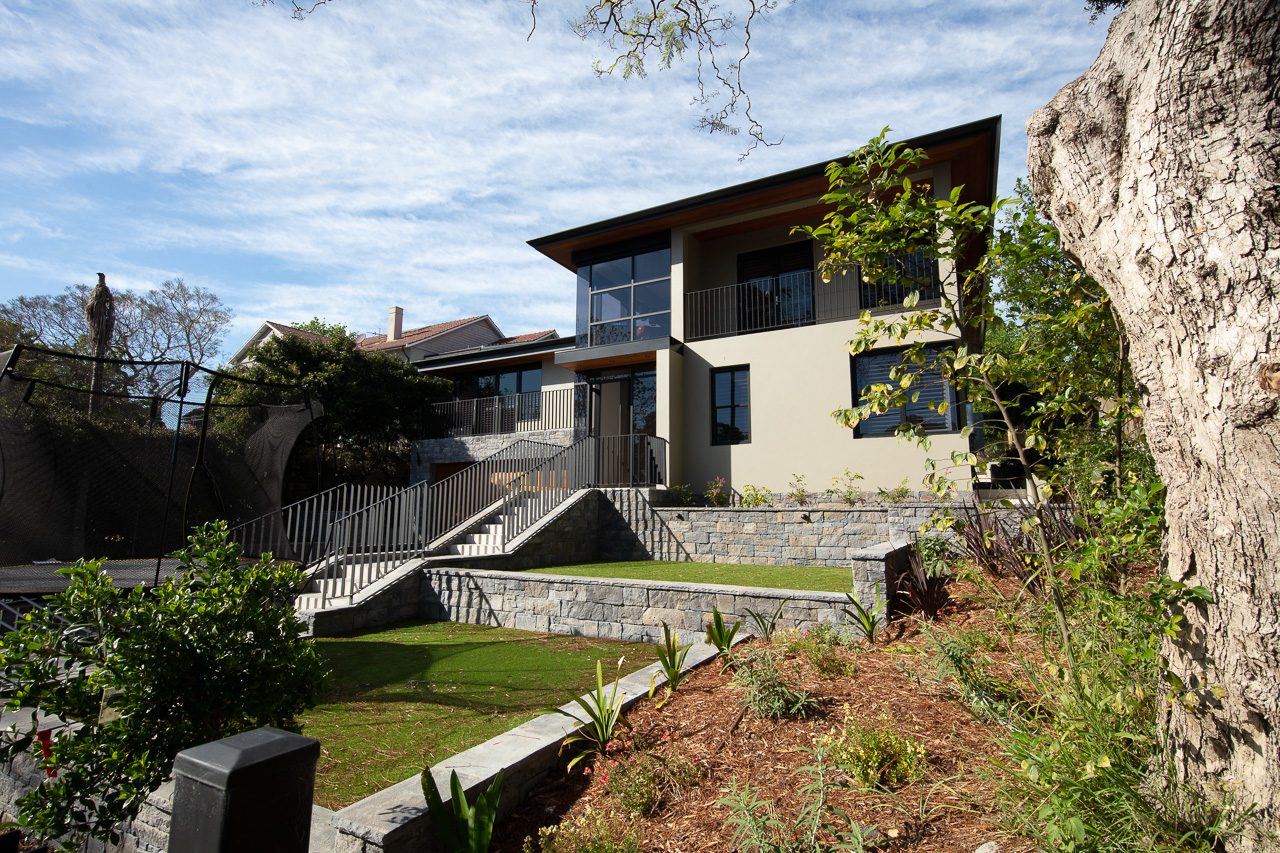 Hunters Hill, garden view of home from lawn with sandstone rock outcrop, built by HP Constructions with Dale Design Group
