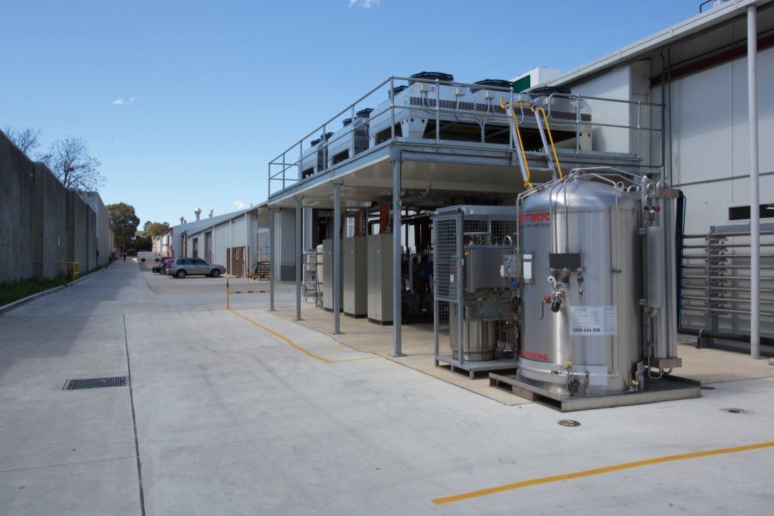 Kitchen Food Company, exterior driveway beside plant equipment and a storage tank, built by HP Constructions