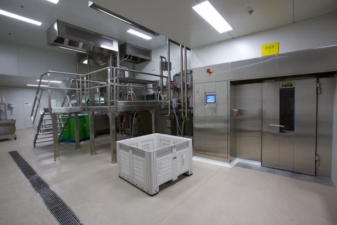 Kitchen Food Company, stainless production room with processing equipment and access stairs, built by HP Constructions