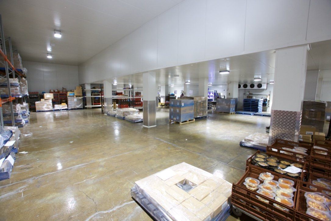 Kitchen Food Company, large refrigerated storeroom with shelving and product pallets, built by HP Constructions