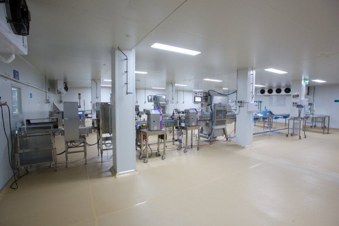 Kitchen Food Company, production room with stainless-steel processing machinery, built by HP Constructions