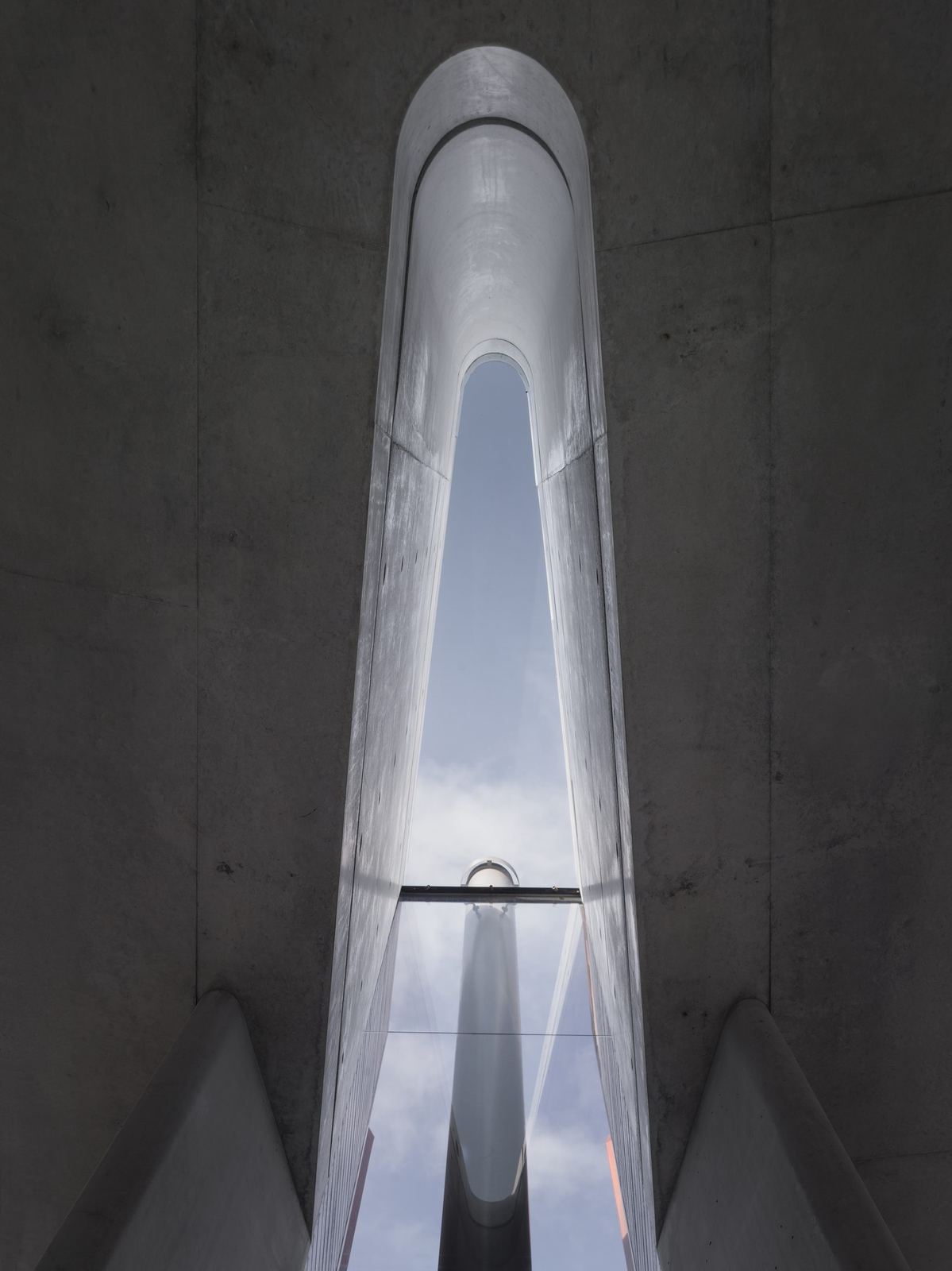 Lurline Bay, board-formed concrete stair void beneath a sculptural skylight, built by HP Constructions with FJC Studio