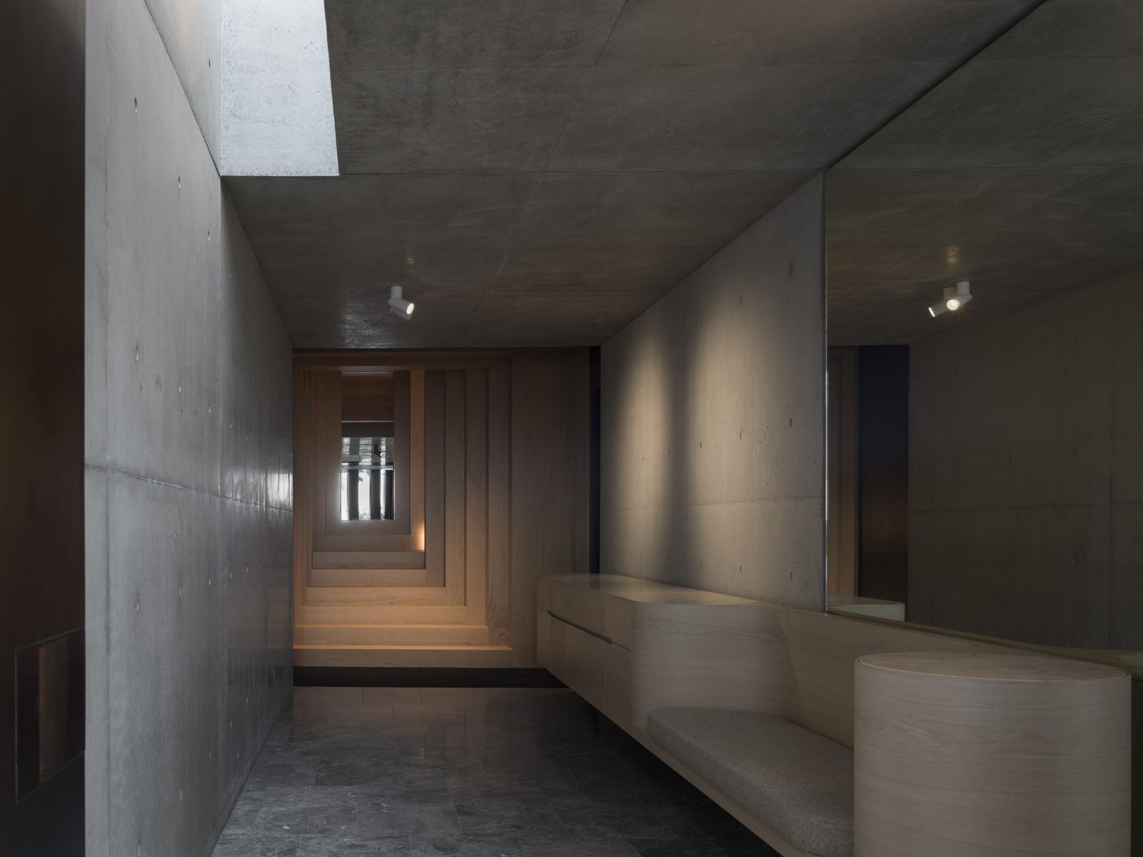 Lurline Bay, concrete gallery hallway with a built-in timber bench, built by HP Constructions with FJC Studio