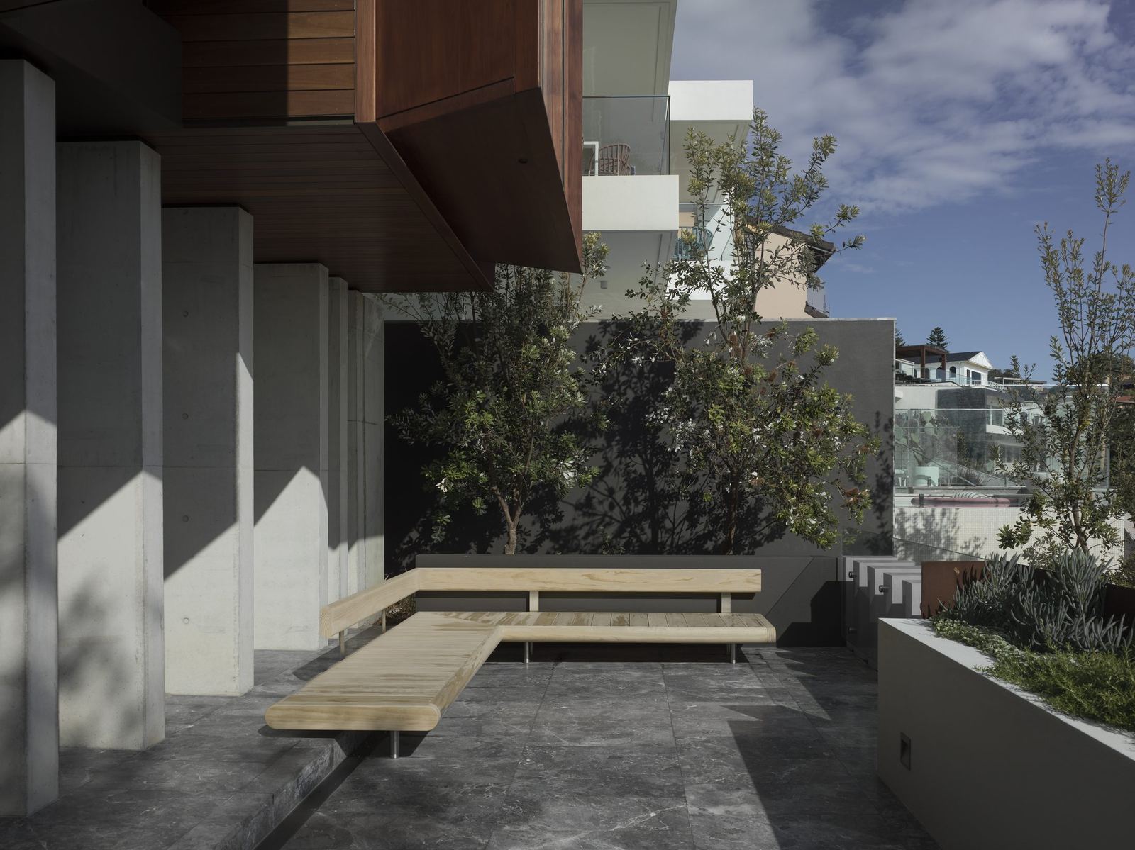 Lurline Bay, landscaped terrace with timber deck and concrete blades, built by HP Constructions with FJC Studio