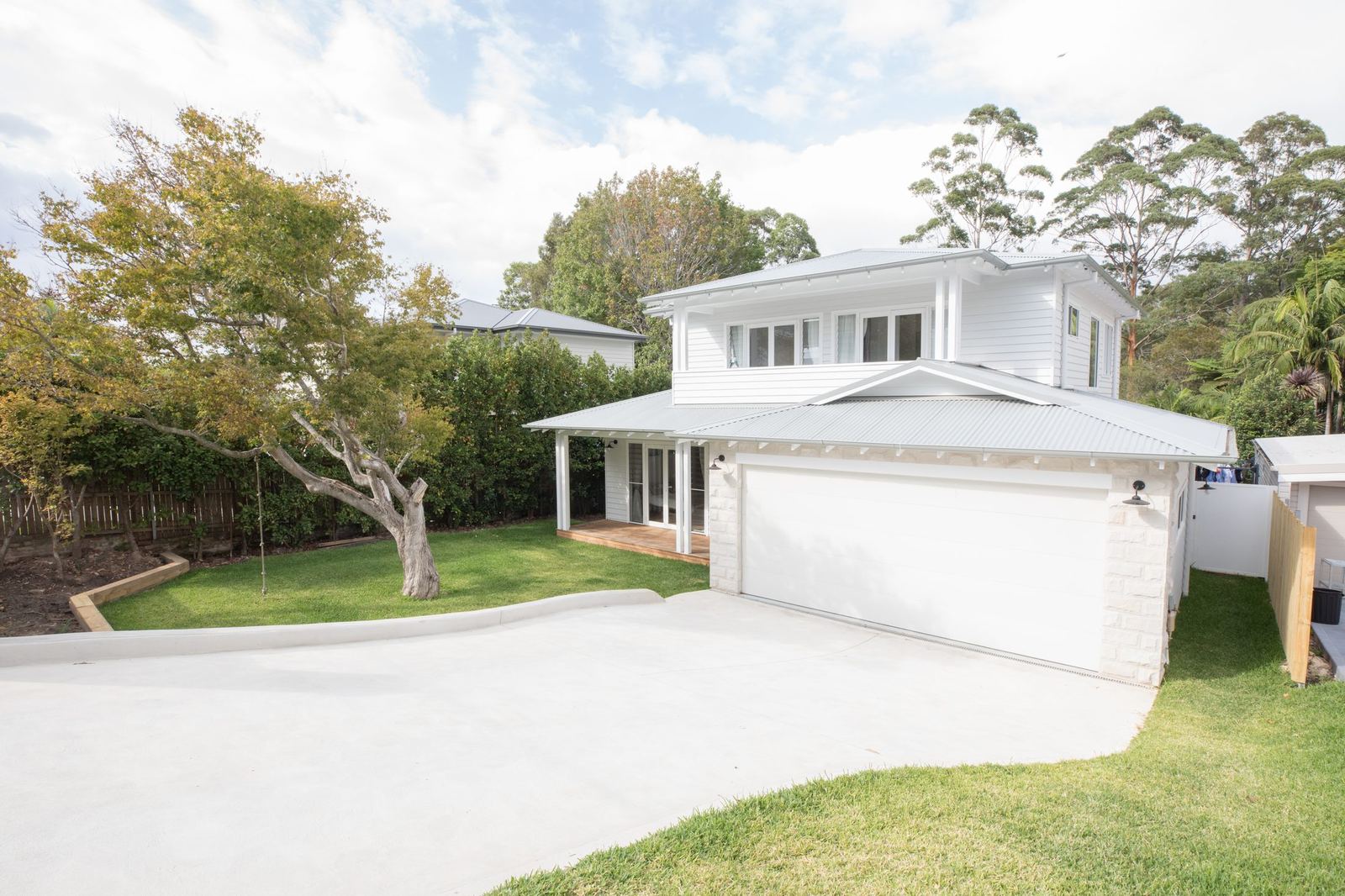 North Balgowlah, front exterior with double garage, driveway and large tree, built by HP Constructions with J.D Evans & Co
