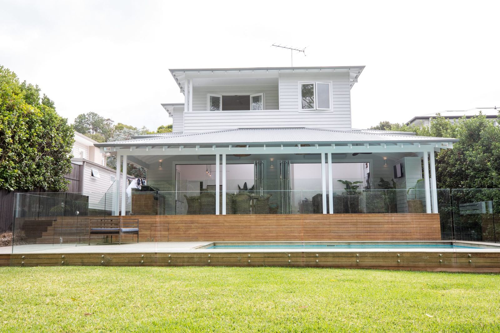 North Balgowlah, rear exterior with covered verandah, glass-fenced pool and deck, built by HP Constructions with J.D Evans & Co