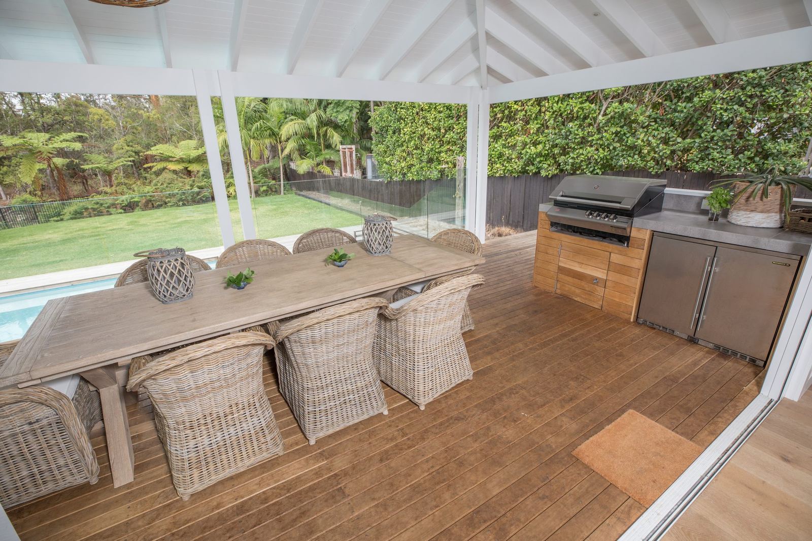 North Balgowlah, covered deck with timber dining table, wicker chairs and barbecue, built by HP Constructions with J.D Evans & Co