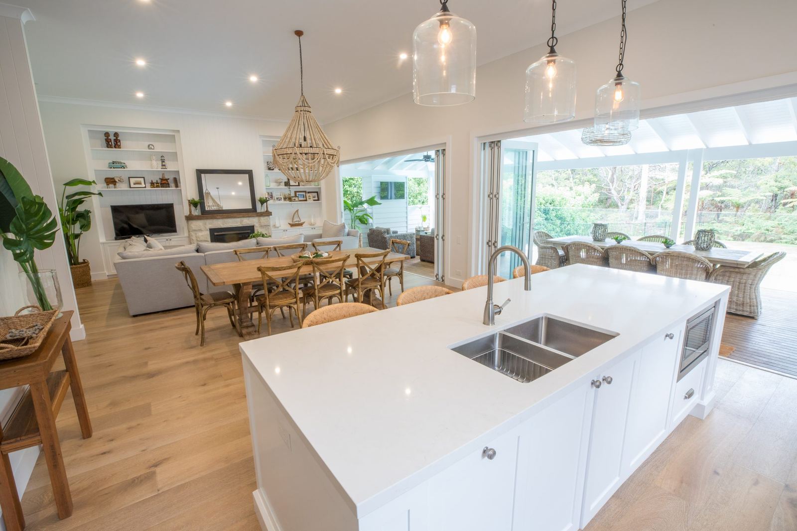 North Balgowlah, open-plan kitchen and living with white island and pendant lights, built by HP Constructions with J.D Evans & Co
