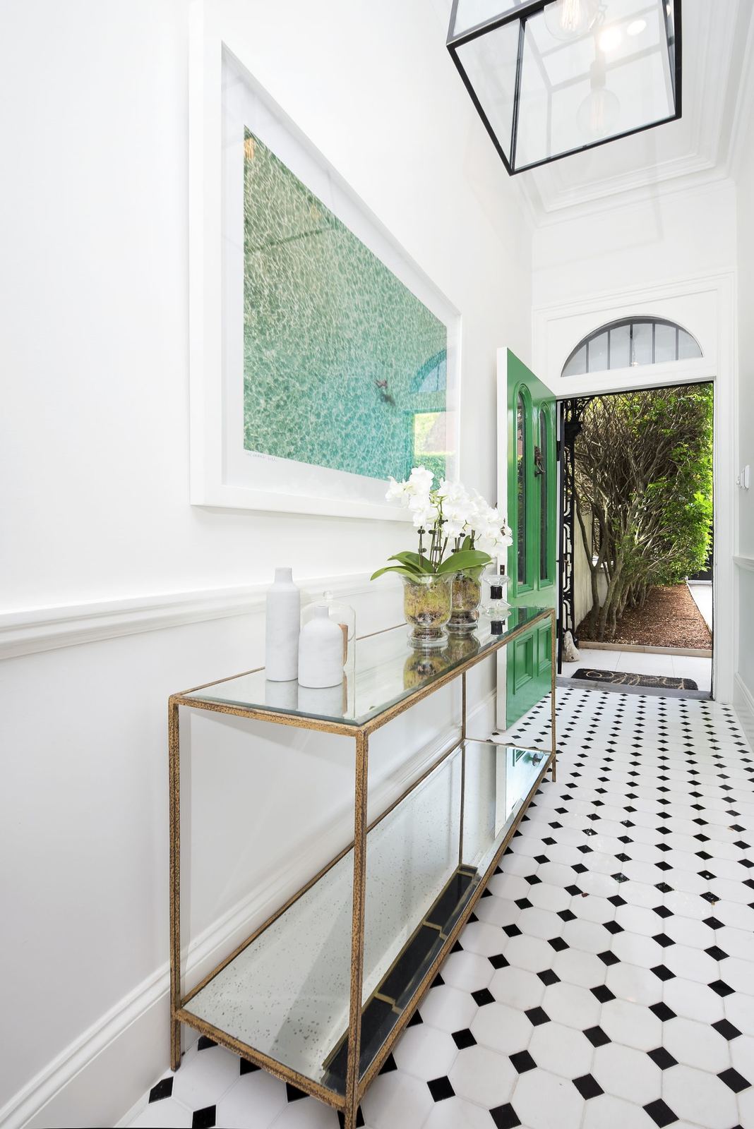 Paddington, entry hallway with black-and-white tiled floor and arched garden doorway, built by HP Constructions with Gutnik Design Group