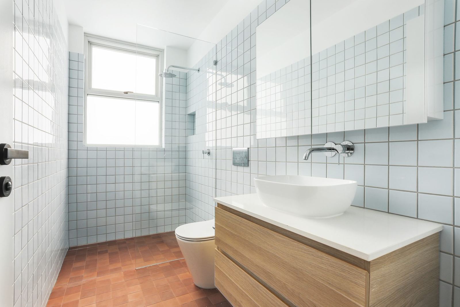 Queens Park Apartments, tiled bathroom with vessel basin, timber vanity and toilet, built by HP Constructions with Ignite Architects