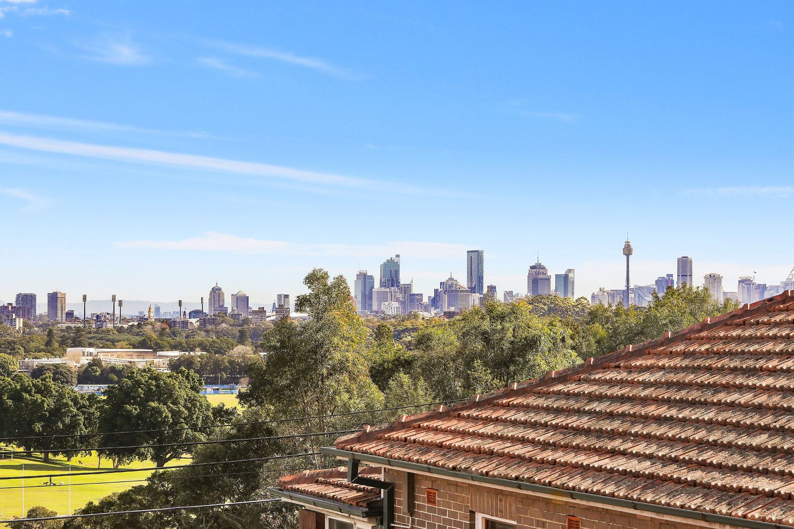 Queens Park Apartments, rooftop outlook toward the Sydney city skyline, built by HP Constructions with Ignite Architects