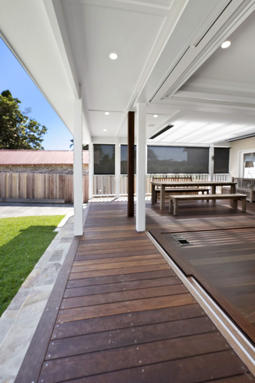 Seaforth, covered spotted gum deck with view to outdoor dining and lawn, built by HP Constructions with Playoust Churcher