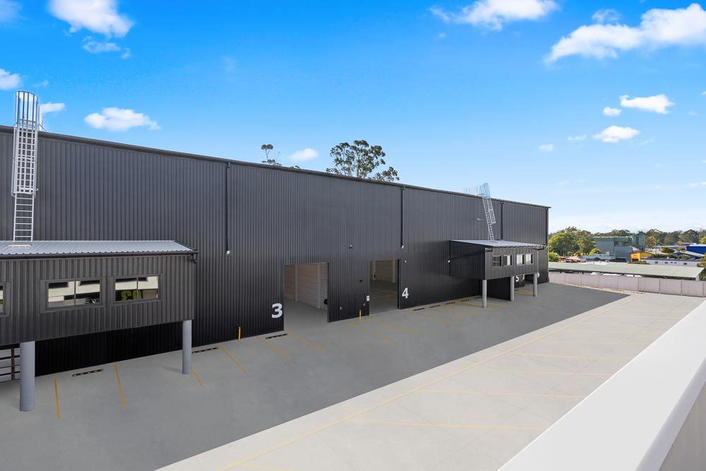 Thornleigh Warehouse, grey warehouse exterior with numbered loading docks under blue sky, built by HP Constructions