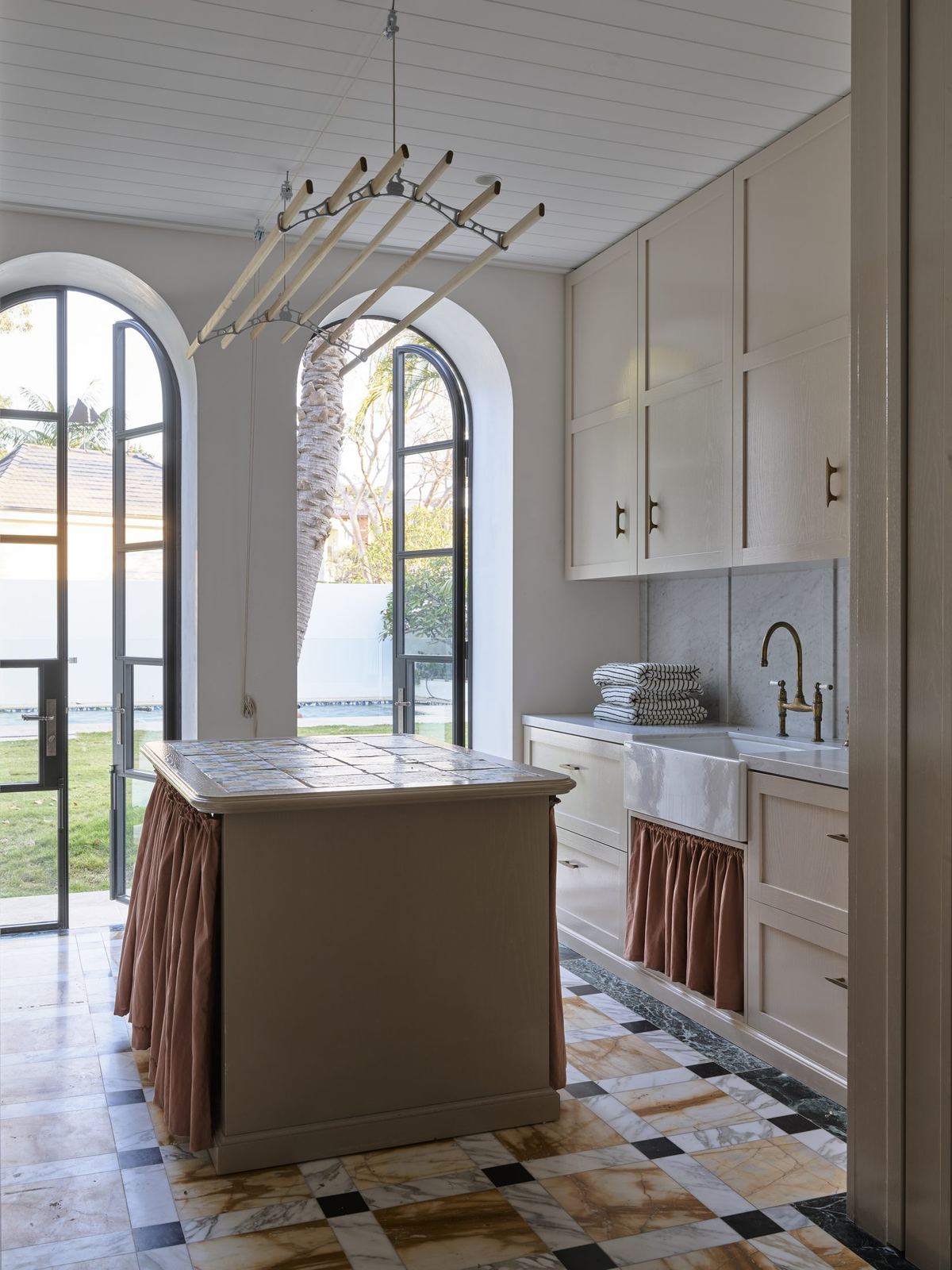 Vaucluse, scullery with skirted island, arched window and water view beyond, built by HP Constructions with Alexander & Co