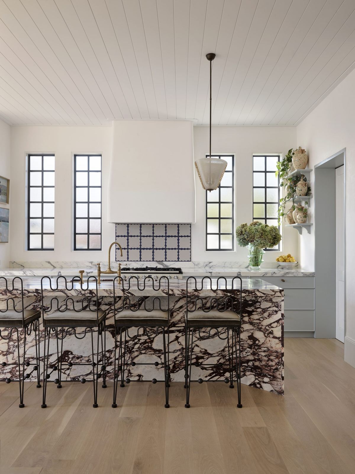Vaucluse, kitchen with marble island, black stools and arched steel windows, built by HP Constructions with Alexander & Co