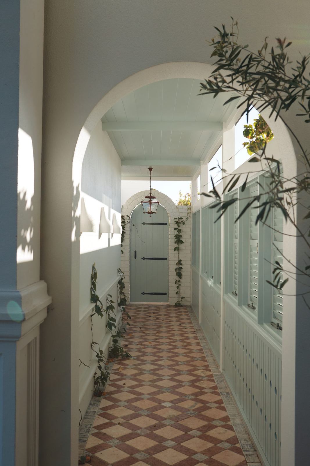 Vaucluse, arched hallway with patterned tiled floor and trained climbing plants, built by HP Constructions with Alexander & Co