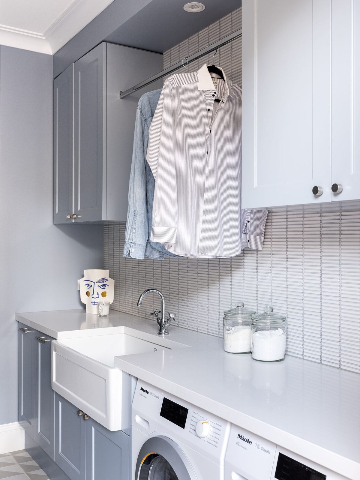 Willoughby, laundry with grey cabinetry, hanging rail and washing machine, built by HP Constructions with Alexander & Co