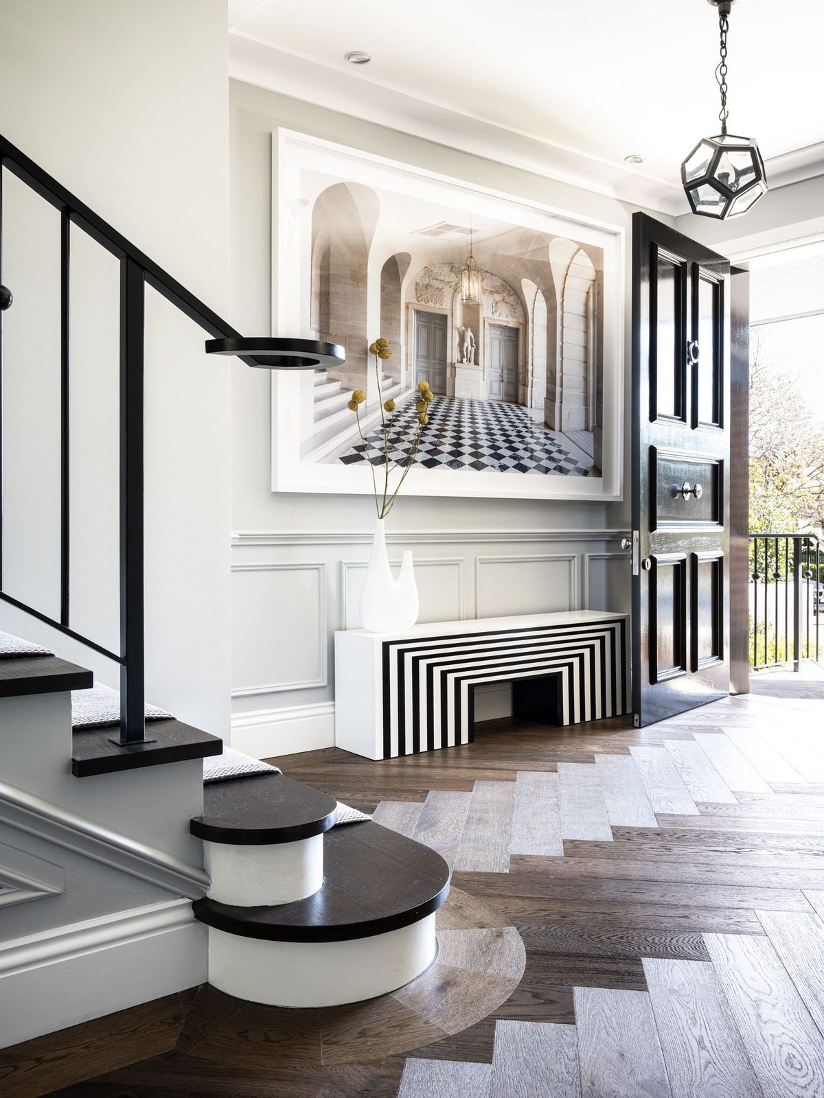 Willoughby, entry hall with staircase, herringbone floor and striped rug, built by HP Constructions with Alexander & Co