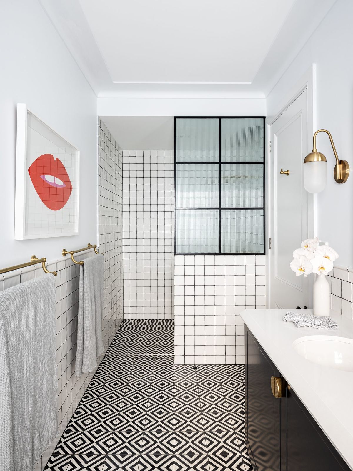 Willoughby, bathroom with patterned tiled floor and steel-framed shower screen, built by HP Constructions with Alexander & Co