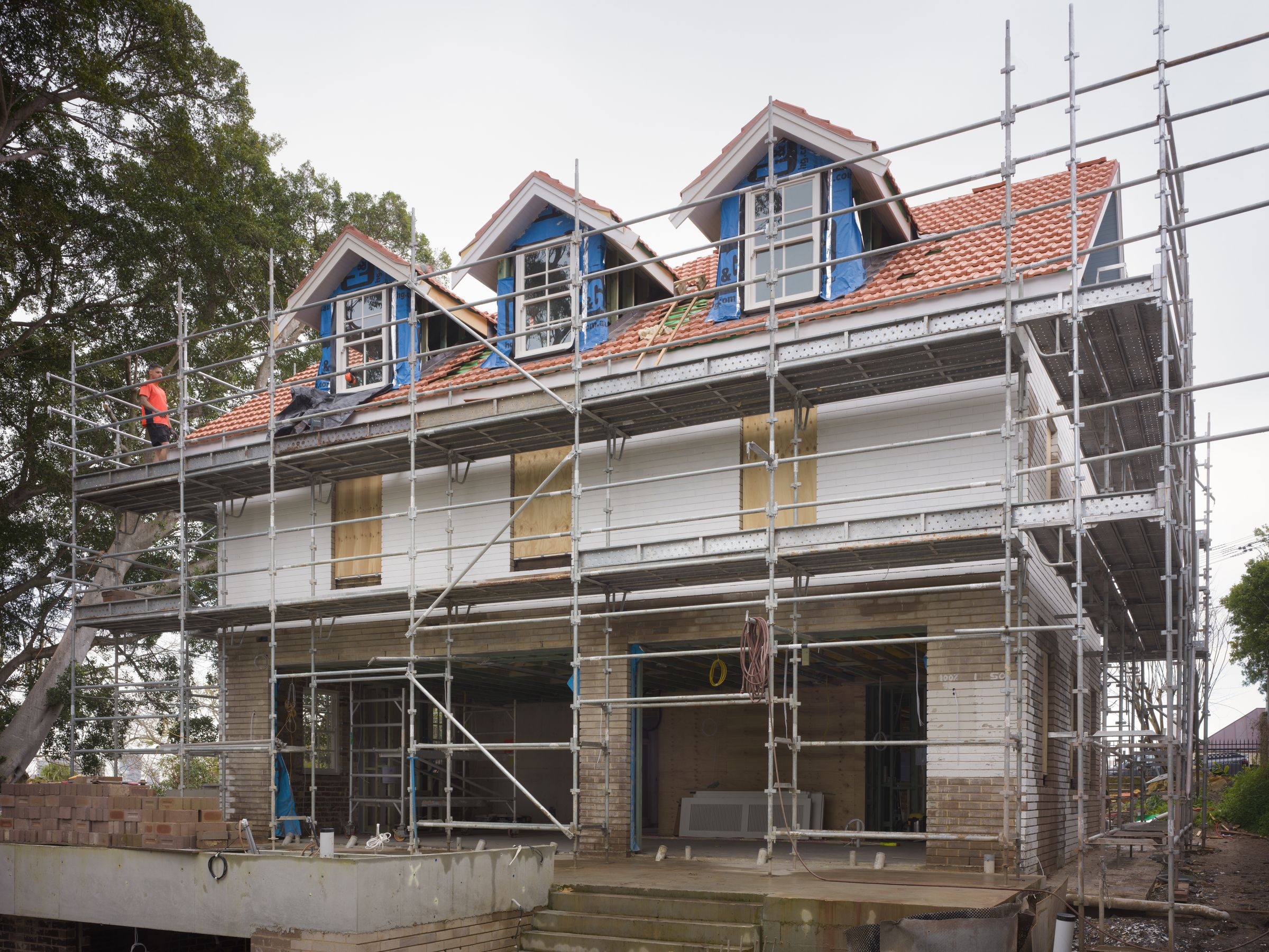 Bellevue Hill heritage home under scaffold during renovation by HP Constructions
